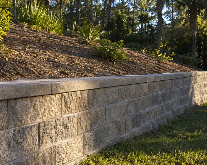 Concrete block retaining wall on a sloped lot